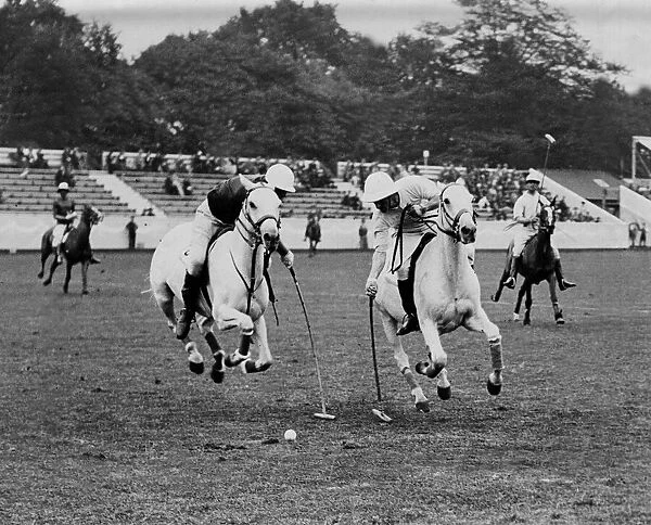 Polo players on horseback in action. England v Rest. Lord Wodehouse attacking Rest