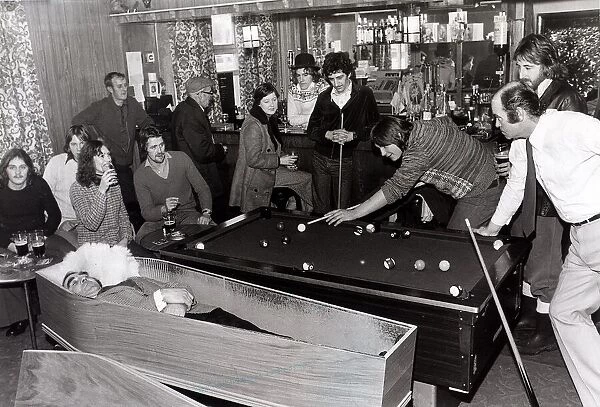 Pool players at the Smelters Arms in Castleside Co. Durham playing alongside a coffin in