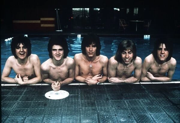Pop group The Bay City Rollers pose in the swimming pool. 11th March 1975