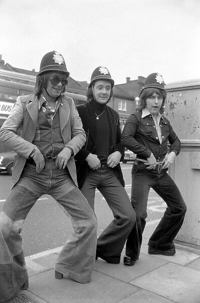 Pop Group 'Mud'dressed in police helmets May 1975
