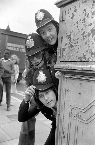 Pop Group 'Mud'dressed in police helmets May 1975