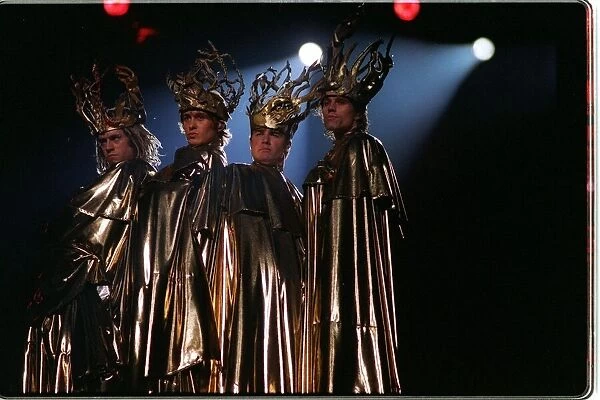 Take That the pop group perform their live concert in costume