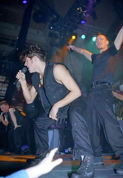Pop group take That performing live on stage at a concert November 1992