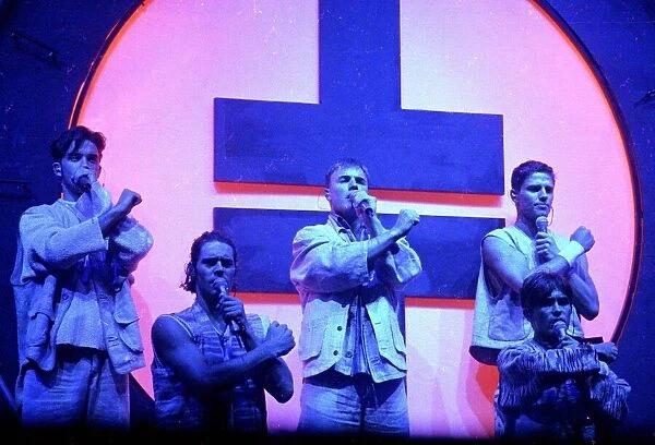 Pop group Take That performing live on stage during a concert October 1993