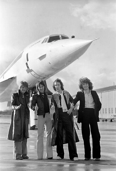 The pop group 'Pilot'pictured here with Concorde. January 1975 75-00996