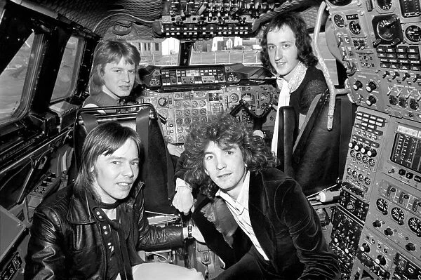 The pop group 'Pilot'pictured here with Concorde. January 1975 75-00996
