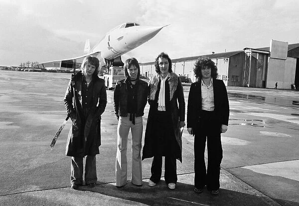 The pop group 'Pilot'pictured here beside the famous supersonic airliner