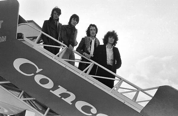 The pop group 'Pilot'pictured here beside the famous supersonic airliner