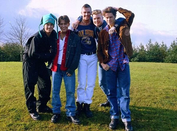 Pop group Take That pose for group photographs. Left to right are: Robbie Williams