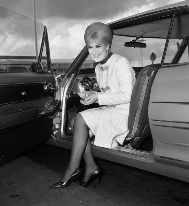 Framed Print : Pop singer Dusty Springfield at London airport before leaving for New York April