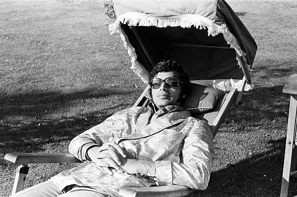 Pop singer Englebert Humperdinck relaxing in the garden of his county house near Great