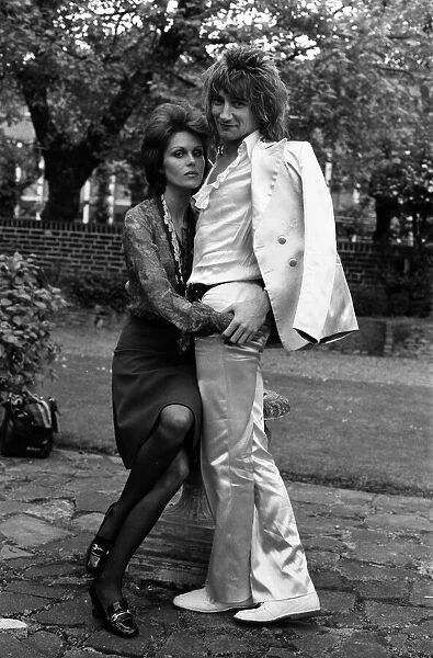 Pop singer Rod Stewart with his new girlfriend actress Joanna Lumley in her garden at her