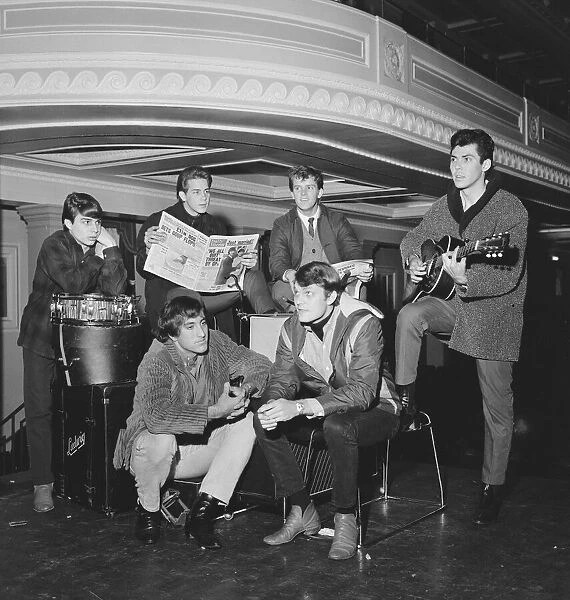 Pop singer Tommy Roe (front right) with his group The Roemans waiting on their packed