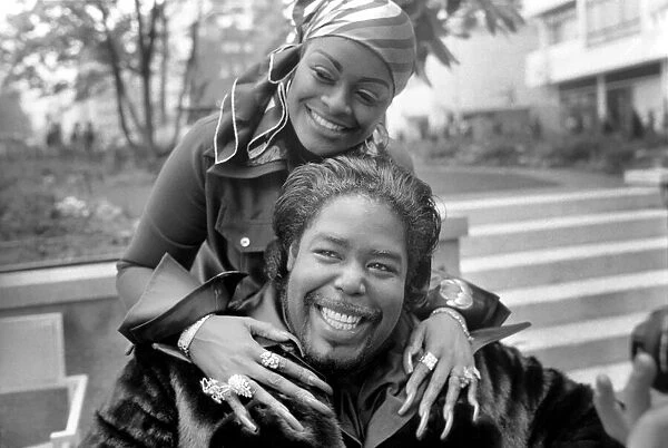 Pop star Barry White with his wife Goldean displaying her affections