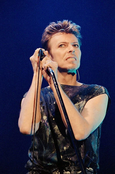 Pop star David Bowie performing on stage during a concert at The Scottish Exhibition