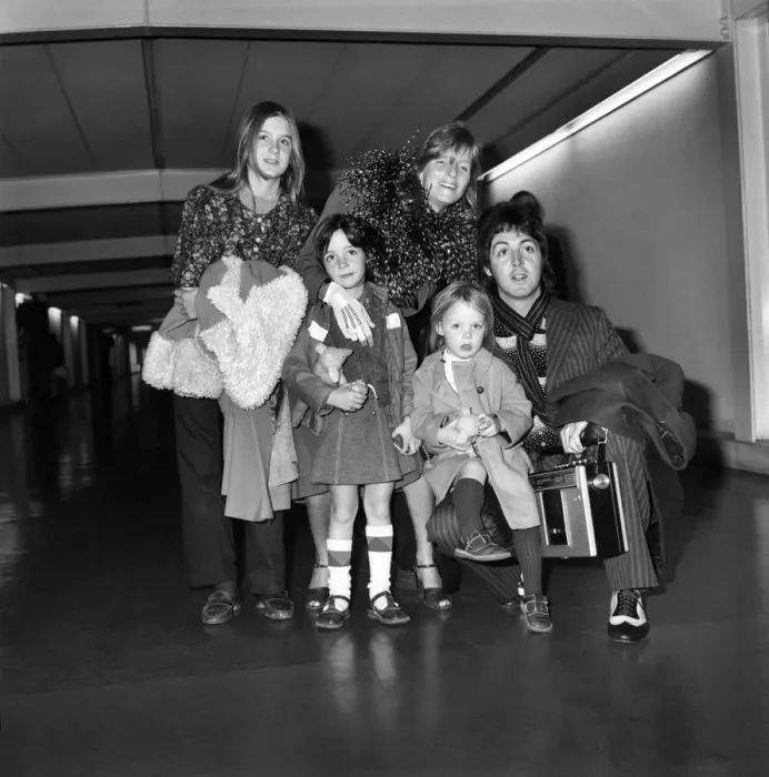 Framed Print : Pop star Paul McCartney and family. Carrying a portable radio