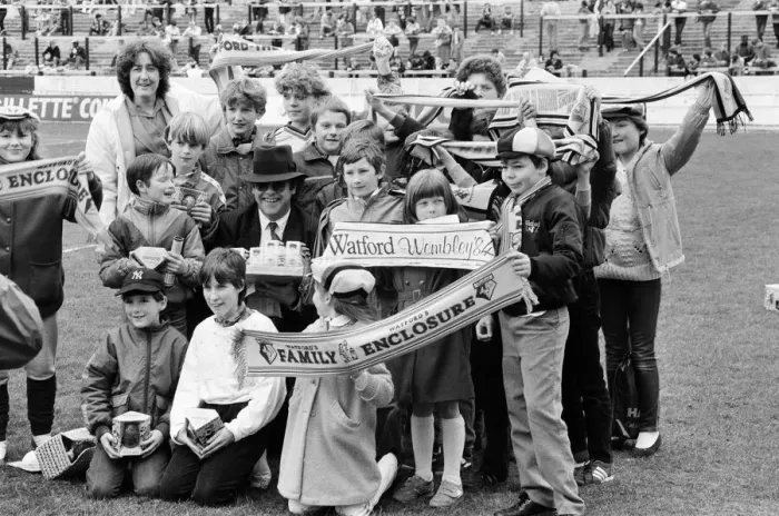 Framed Print : Pop star and Watford FC Chairman, Elton John, handing out Easter eggs to fans Framed Print : Pop star and Watford FC Chairman, Elton John, handing out Easter eggs to fans