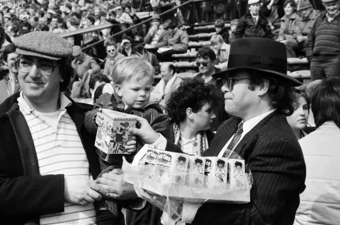 Framed Print : Pop star and Watford FC Chairman, Elton John, handing out Easter eggs to fans Framed Print : Pop star and Watford FC Chairman, Elton John, handing out Easter eggs to fans