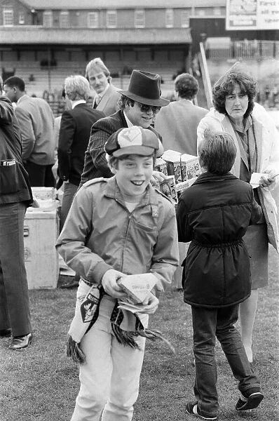 Pop star and Watford FC Chairman, Elton John, handing out Easter eggs to fans