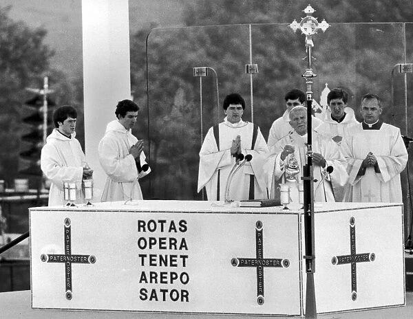 Pope John Paul II assisted by priests, leads the Mass at Heaton Park, Manchester