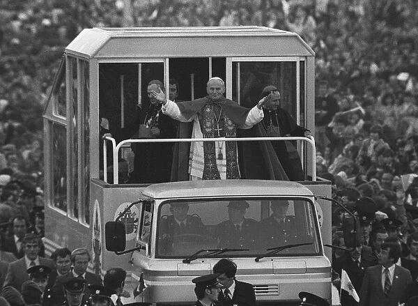 Pope John Paul II gives a blessing from his popemobile during his visit to ireland