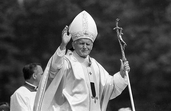 Pope John Paul II waves to the welcoming crowd at Cardiff airport, 2nd June 1982