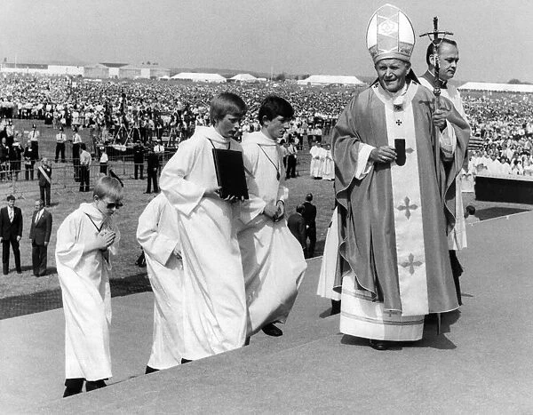 Pope John Paull IIs visit to Coventry. The Pope moves across the giant dais as