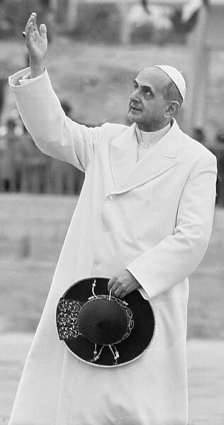 Pope Paul VI waves to the crowds after landing in Amman on January 4, 1964