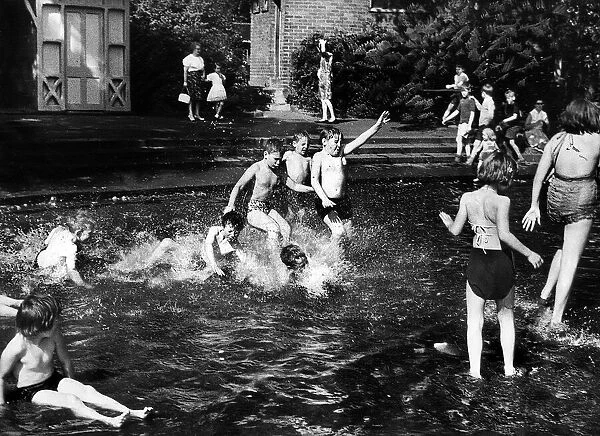 The ever popular childrens pool in Newcastles Brandling Park is crowded as boys