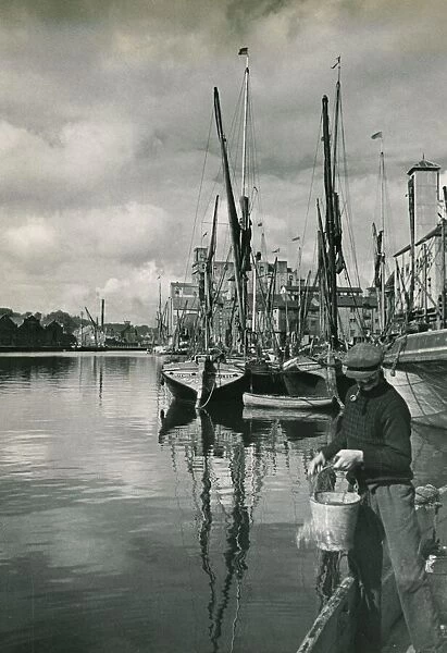 The Port at Ipswich is busy again after the War. barges dock to discharge