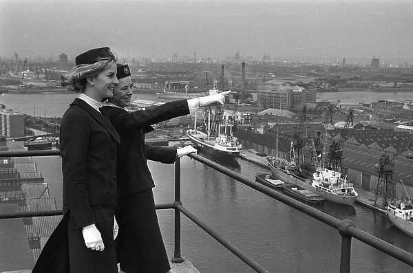 Port of London Dock Guides June 1965. Two of the guides talk as they look over the ships