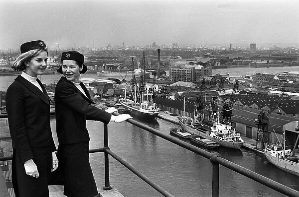 Port of London Dock Guides, June 1965. Two of the guides talk as they look over