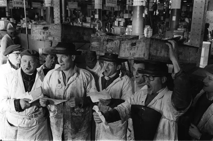 Framed Print : The porters at Billingsgate in London took a break from hauling fish to sing in a