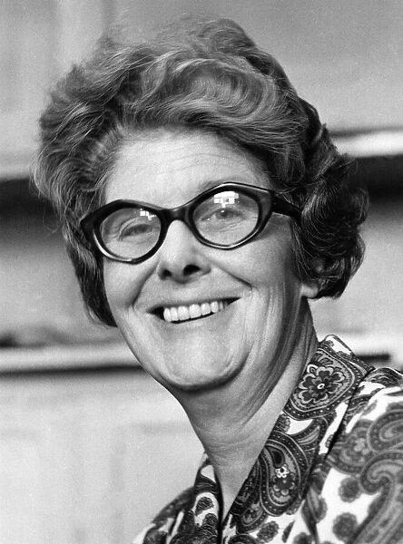 Portrait of a happy elderly woman wearing glasses. September 1974 P007861