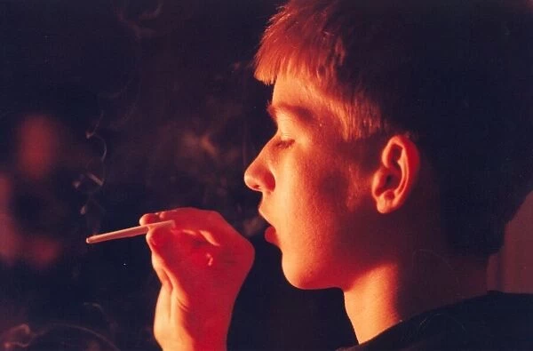 A posed model picture of an underage smoker 1st January 1990