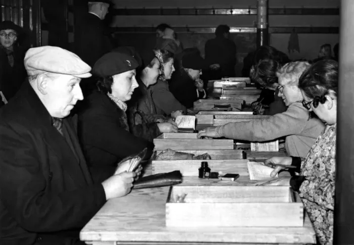 Framed Print : Post World War Two - Second World War - People exchange old ration books for new issues Framed Print : Post World War Two - Second World War - People exchange old ration books for new issues