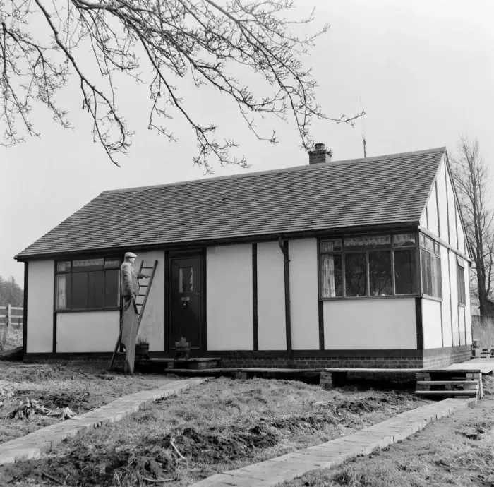 Framed Print : Prefab Bungalow. Prefab Housing. Mr Baker examines his new £ Framed Print : Prefab Bungalow. Prefab Housing. Mr Baker examines his new £