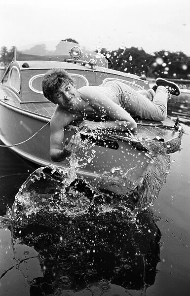 President of Bermondsey Boat Club Tommy Steele relaxes at his Thames side house at