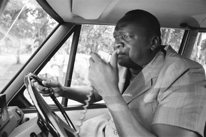Framed Print : President Idi Amin at the wheel of his Range Rover at Entebbe Airport near Kampala Framed Print : President Idi Amin at the wheel of his Range Rover at Entebbe Airport near Kampala