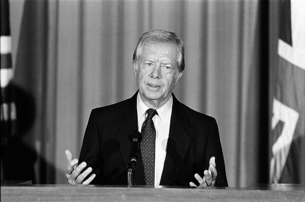 Former President Jimmy Carter talks to the press at the American Embassy on overseas