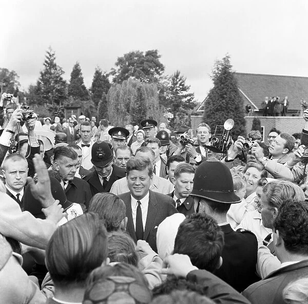 President John F Kennedy on a vist to England June 1963 walks through a crowd of well