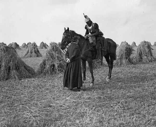 A priest talks to a French Cuirassiers in a corn field on the Belgium - France border