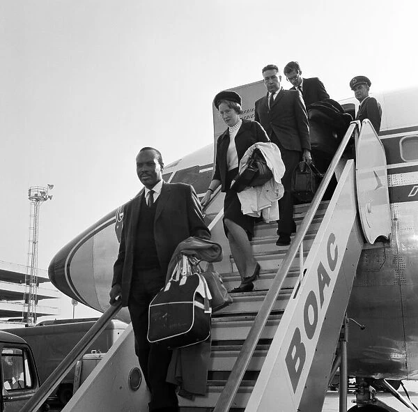 Prime Minister of Bechuanaland, Seretse Khama, and his wife Ruth Williams Khama arriving