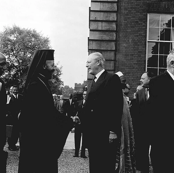 Prime Minister Harold MacMillan greets one time enemy Archbishop Makarios of Cyprus at a