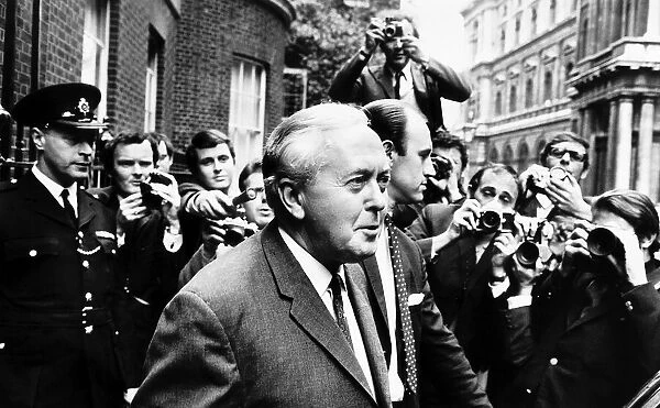 Prime Minister Harold Wilson leaving 10 Downing Street on his way to Buckingham Palace to