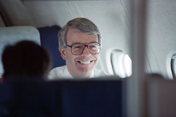 Prime Minister John Major pictured on an aeroplane. 17th March 1992