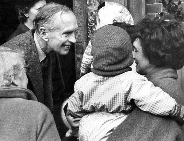 Prime Minister in Lancashire. Sir Alec Douglas Home pauses to speak to a young child as