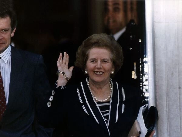 Prime Minister Margaret Thatcher waving as she walks out of the house November 1990