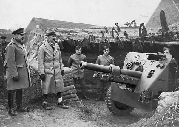 The Prime Minister Neville Chamberlain inspects a 25-pdr field gun at Bachy