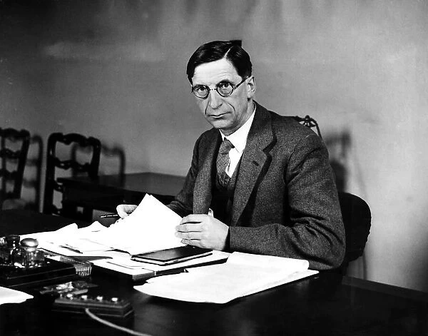 Prime Minister of the Republic of Ireland Mr Eamon De Valera seated at his desk
